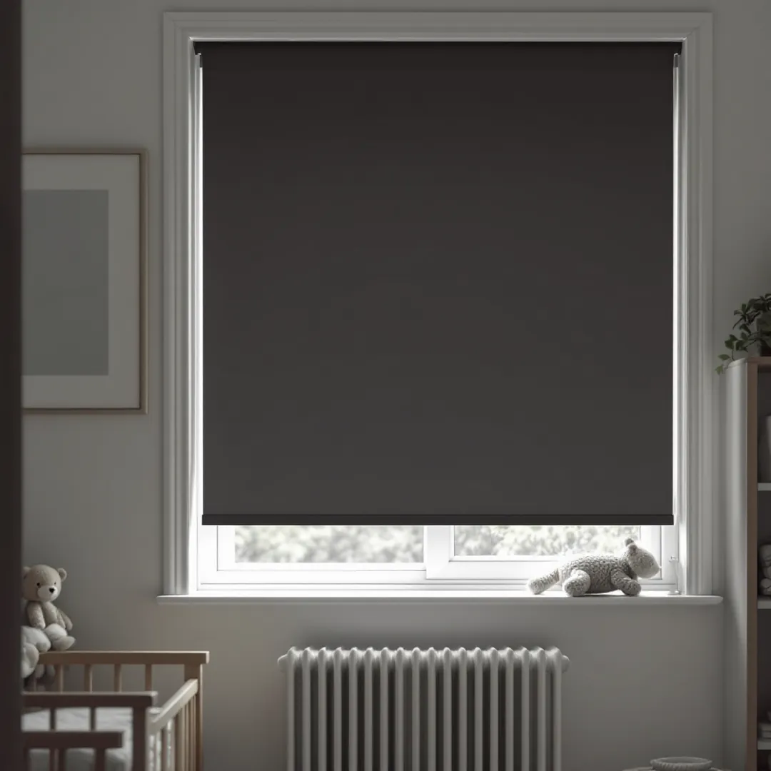 Charcoal blackout roller blind keeping a nursery dark for naptime.